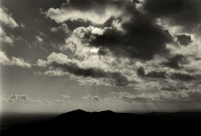 Scenic view of silhouette mountains against sky