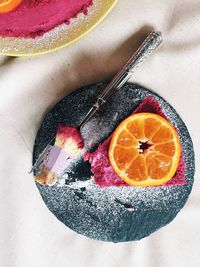 High angle view of fruits in plate on table