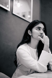 Portrait of young woman looking away