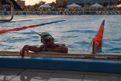 Man swimming in pool