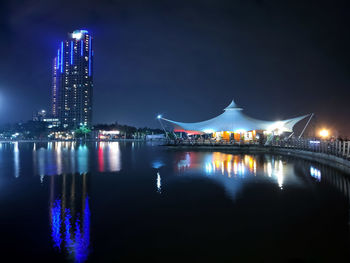 Illuminated buildings at waterfront