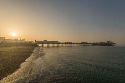 Scenic view of sea against clear sky during sunset