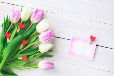 High angle view of pink tulips on table