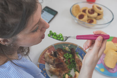 High angle view of woman having food