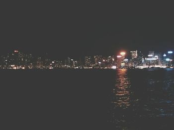 Illuminated cityscape at night