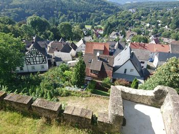 High angle view of houses against trees