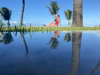 Woman by the pool with reflection 