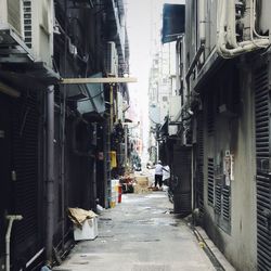 Narrow alley amidst buildings in city