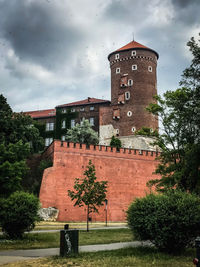 View of old building against cloudy sky