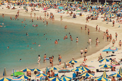 People enjoying on beach