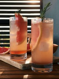 Still life of paloma cocktails with grapefruits at background