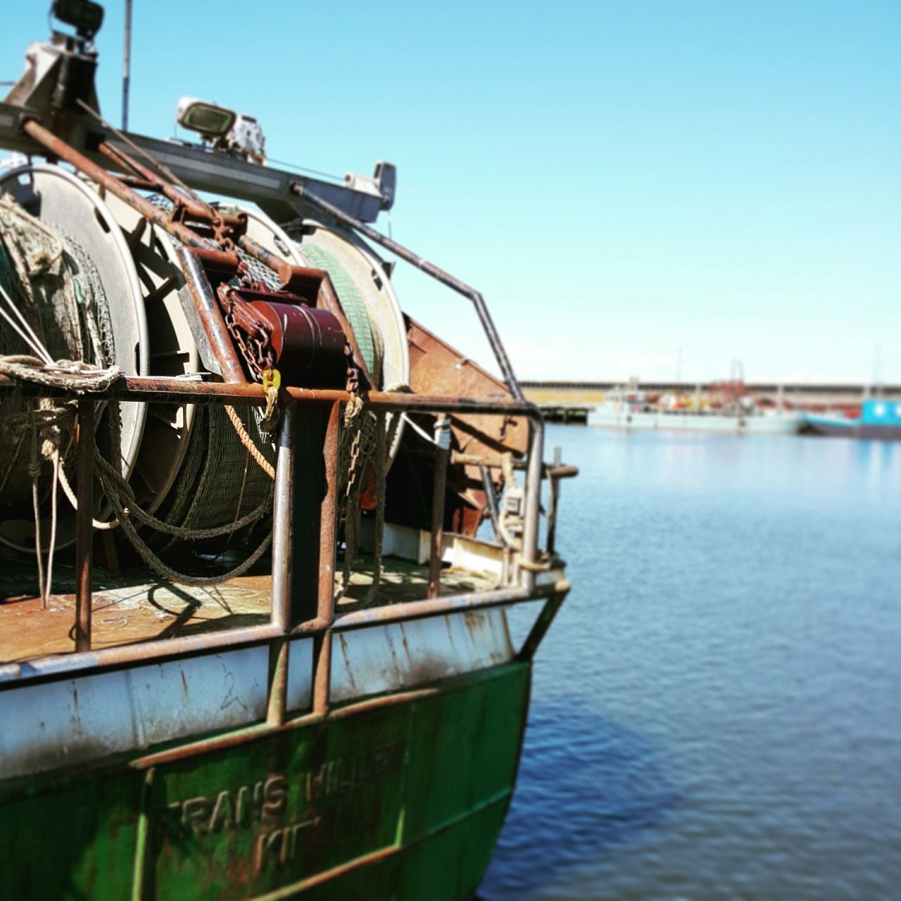 nautical vessel, transportation, mode of transport, boat, water, moored, clear sky, blue, sea, waterfront, river, day, sky, reflection, outdoors, lake, no people, nature, travel, harbor