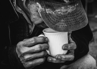 Close-up of man drinking coffee