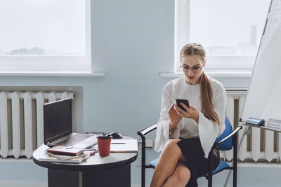 Young woman using mobile phone