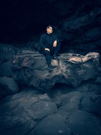 High angle view of man on rocks during winter