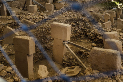 High angle view of stone wall by building