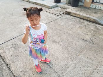 High angle view of cute girl wearing hat