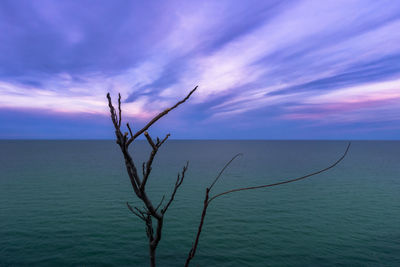 Scenic view of sea against cloudy sky