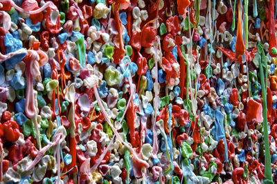 Full frame shot of multi colored chewing gum hanging at market