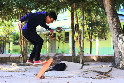 Man skateboarding in park