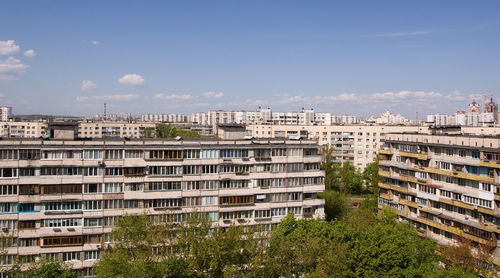 High angle view of buildings in city against sky