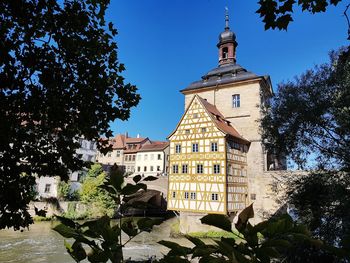 Low angle view of buildings against blue sky