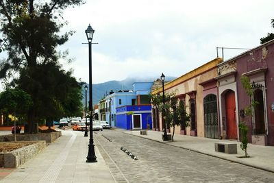 Street in city against sky