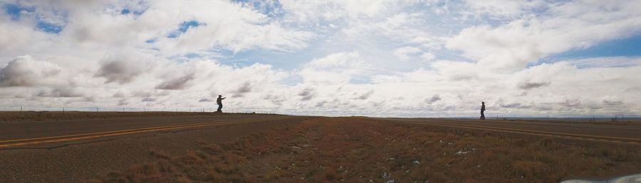 Road by landscape against sky