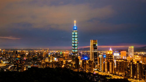 Illuminated buildings in city at night