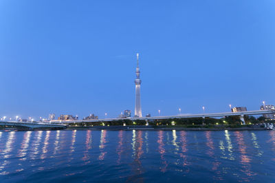 Tokyo skytree and sumida river against clear blue sky