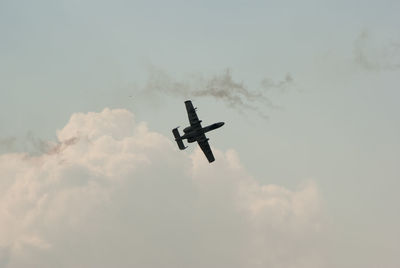 Low angle view of airplane against sky