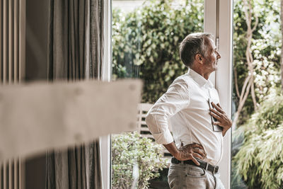 Man standing by window