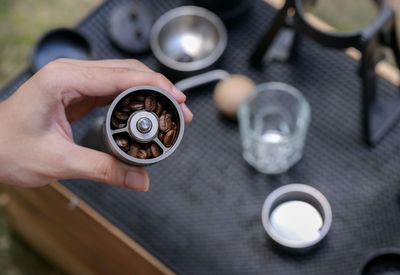 Cropped hand holding navigational compass