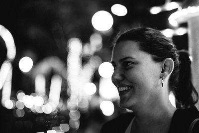 Close-up portrait of smiling young woman