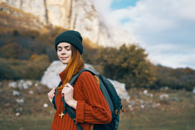 Young woman standing in park during winter