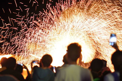 Rear view of people enjoying music concert