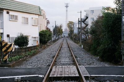 View of railway tracks along buildings