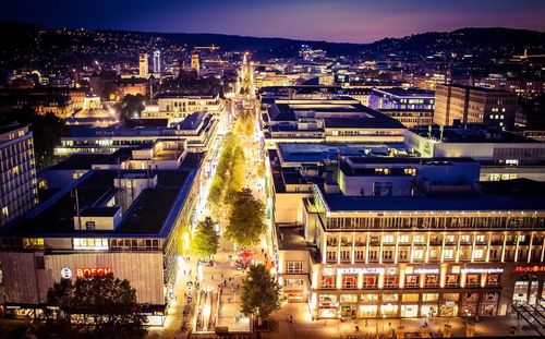 Aerial view of city lit up at night