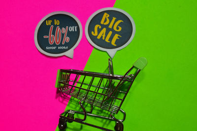 Close-up of text against pink background