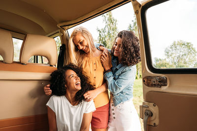 Group of female friends in camping van