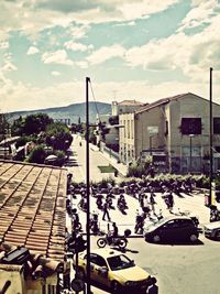 Buildings against cloudy sky