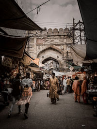 People walking on street market in city