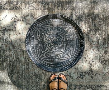 Low section of woman standing on floor