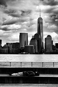 Cityscape against cloudy sky