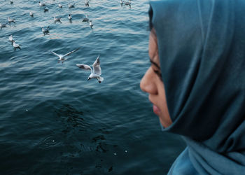 Seagulls flying over sea