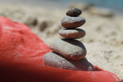 Close-up of stone stack on beach