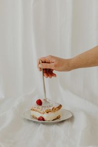 Cropped hand of person holding ice cream