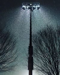 Low angle view of illuminated street light against sky at night