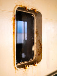 Close-up of old window of abandoned building