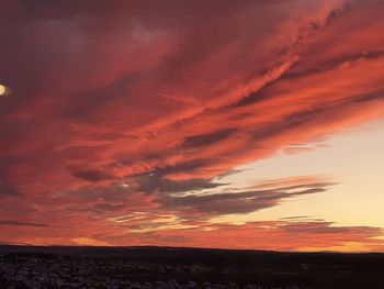 Scenic view of dramatic sky during sunset